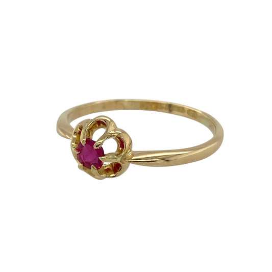 Bring historic charm and vibrant colour to your collection with this pre-owned 18ct yellow gold vintage ring, hallmarked in Chester circa 1916 and styled with a ruby in a floral design.

Design: The ring features a 4mm round ruby at the centre of a delicate flower-style setting, capturing the elegance and character of early 20th-century jewellery.
Material: Made from 18-carat yellow gold, the polished finish enhances the warm tone and complements the vivid red of the ruby.