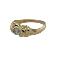 Load image into Gallery viewer, Add classic sparkle to your collection with this pre-owned 9ct yellow gold diamond solitaire ring, a timeless design with subtle detailing for everyday elegance.

Design: The ring features a central brilliant-cut diamond of approximately 0.18ct, complemented by shaped detailing along the shoulders for added character.
Material: Made in 9-carat yellow gold, the polished finish provides a warm and radiant backdrop that enhances the diamond’s brilliance.
