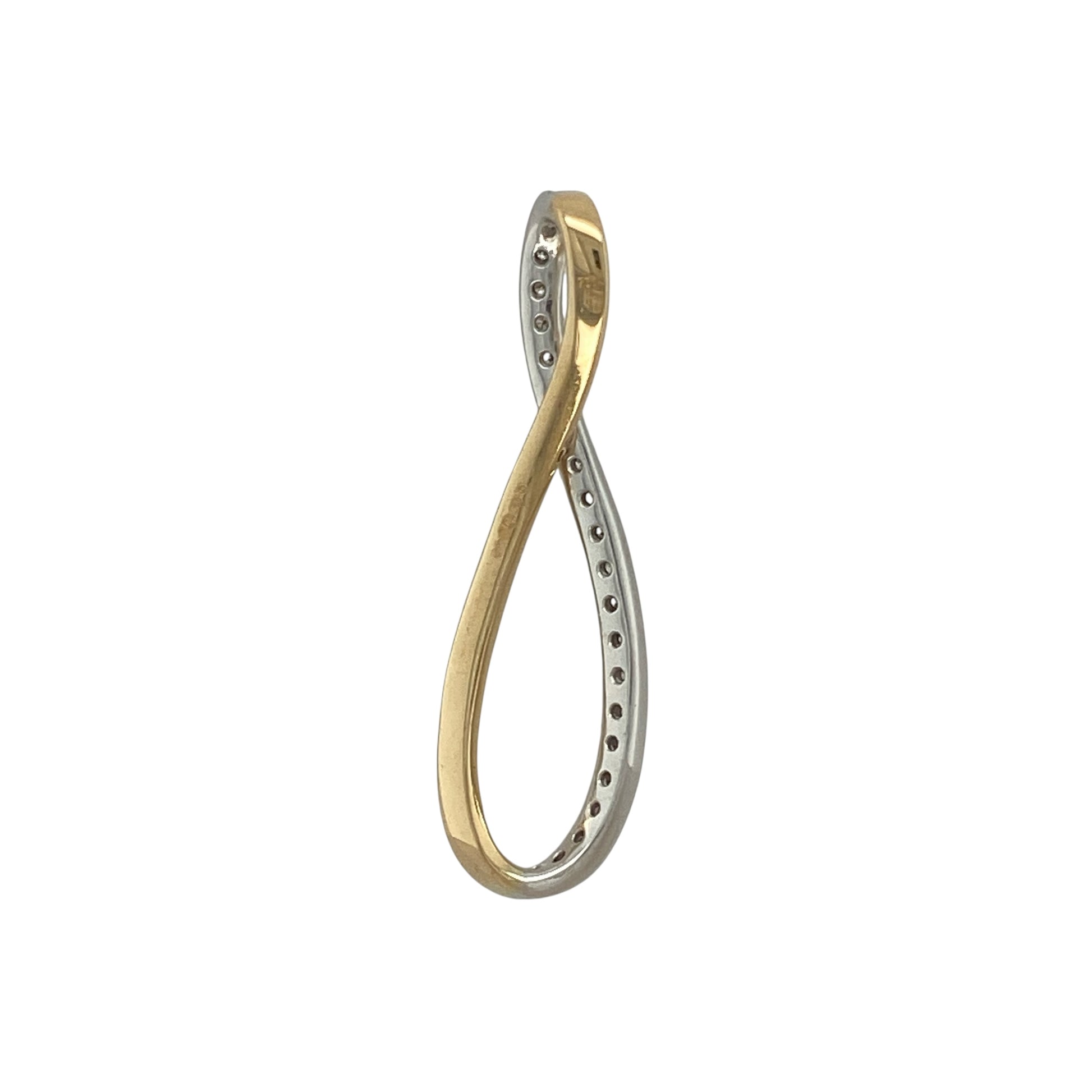 Bring graceful sparkle to your collection with this pre-owned 18ct yellow and white gold diamond swirl pendant, a flowing design with timeless elegance.

Design: The pendant features an elegant swirl motif, beautifully accented with sparkling diamonds for a refined and eye-catching look.
Material: Made in 18-carat yellow and white gold, the polished finish enhances the contrast of tones while highlighting the brilliance of the diamonds.