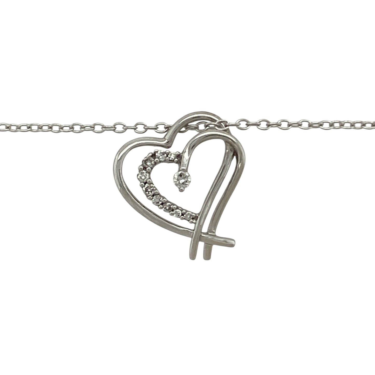 Celebrate love and sparkle with this pre-owned 9ct white gold double heart diamond pendant, paired with a 16" belcher chain for a timeless and romantic look.

Design: The pendant features two interlinked hearts, delicately accented with diamonds for a touch of brilliance and sentiment.
Material: Made in 9-carat white gold, the polished finish enhances the diamonds’ radiance and gives a sleek, modern tone.