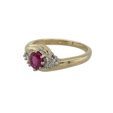 Load image into Gallery viewer, Add rich colour and sparkle to your collection with this pre-owned 9ct yellow gold ruby and diamond cluster twist ring, a timeless design with elegant detail.

Design: The ring features a 5mm by 4mm oval ruby at the centre, surrounded by a cluster of diamonds in a graceful twist design for added brilliance.
Material: Made in 9-carat yellow gold, the polished finish provides a warm glow that enhances the deep red of the ruby and the sparkle of the diamonds.
