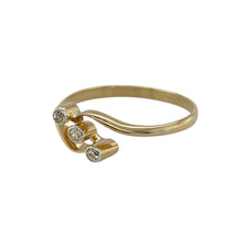 Load image into Gallery viewer, Celebrate love and sparkle with this pre-owned 18ct yellow gold diamond trilogy twist ring, a meaningful design symbolising past, present, and future.

Design: The ring features a trilogy of diamonds in a 7mm high twist setting, creating an elegant flow with brilliant sparkle.
Material: Made in 18-carat yellow gold, the polished finish enhances the warmth of the gold and the brilliance of the diamonds.
