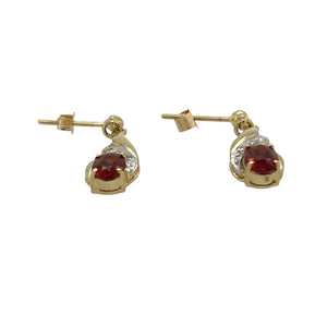 Add warmth and sparkle to your collection with these pre-owned 9ct yellow gold garnet and diamond drop stud earrings, a classic design with rich colour.

Design: Each earring features a 6mm by 4mm oval garnet, accented with diamonds for a refined and elegant finish.
Material: Made in 9-carat yellow gold, the polished finish enhances the deep red tones of the garnet and the brilliance of the diamonds.