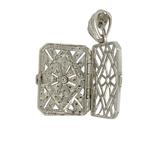 Combine elegance and sentiment with this pre-owned 18ct white gold diamond filigree locket, a timeless piece designed to hold cherished memories.

Design: The locket features a rectangular shape with intricate filigree detail, accented with sparkling diamonds for a refined and decorative finish.
Material: Made in 18-carat white gold, the polished finish enhances the brightness of the metal and the brilliance of the diamonds.