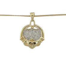 Load image into Gallery viewer, Celebrate love, loyalty, and friendship with this pre-owned 9ct yellow and white gold diamond Claddagh pendant, paired with a 20&quot; curb chain for a meaningful and timeless look.

Design: The pendant measures 2.5cm long including the bail and features the traditional Claddagh motif of hands, heart, and crown, accented with sparkling diamonds. A small engraved ‘J’ adds a personal touch.
