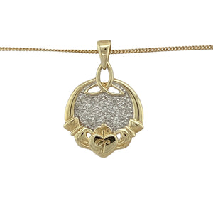 Celebrate love, loyalty, and friendship with this pre-owned 9ct yellow and white gold diamond Claddagh pendant, paired with a 20" curb chain for a meaningful and timeless look.

Design: The pendant measures 2.5cm long including the bail and features the traditional Claddagh motif of hands, heart, and crown, accented with sparkling diamonds. A small engraved ‘J’ adds a personal touch.
