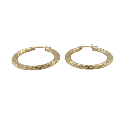 Bring classic style to your collection with these pre-owned 9ct yellow gold patterned hoop Creole earrings, a timeless design with subtle detail.

Design: Each earring features a traditional Creole hoop with a patterned finish, adding texture and elegance to the classic shape.
Material: Made in 9-carat yellow gold, the polished finish enhances the warm golden tone and highlights the decorative pattern.