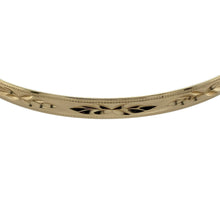 Load image into Gallery viewer, Add timeless elegance to your collection with this pre-owned 9ct yellow solid gold patterned bangle, a classic piece with refined detail.

Design: The bangle features a 5mm wide band with a decorative pattern, offering subtle texture and sophistication.
Material: Made in solid 9-carat yellow gold, the polished finish enhances the warm golden tone and the detailed design.
Bangle Detail: With an internal diameter of 6.7cm, this piece provides a comfortable fit while remaining durable for everyday wear.
