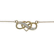 Load image into Gallery viewer, Celebrate everlasting love with this pre-owned 10ct yellow and white gold heart infinity necklace, accented with sparkling cubic zirconia for timeless elegance.

Design: The necklace features a heart intertwined with an infinity symbol, set with cubic zirconia for radiant sparkle. The pendant is paired with an 18&quot; chain for a ready-to-wear look.
Material: Made in 10-carat yellow and white gold, the polished finish enhances the contrast of tones while highlighting the brilliance of the stones.
