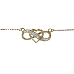Celebrate everlasting love with this pre-owned 10ct yellow and white gold heart infinity necklace, accented with sparkling cubic zirconia for timeless elegance.

Design: The necklace features a heart intertwined with an infinity symbol, set with cubic zirconia for radiant sparkle. The pendant is paired with an 18" chain for a ready-to-wear look.
Material: Made in 10-carat yellow and white gold, the polished finish enhances the contrast of tones while highlighting the brilliance of the stones.