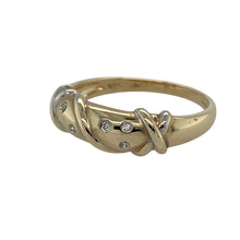 Load image into Gallery viewer, Add subtle sparkle and elegance to your collection with this pre-owned 9ct yellow gold diamond crossover band ring, a timeless style with graceful detail.

Design: The ring features a 5mm wide band with crossover detailing, accented with diamonds for a refined finish.
Material: Made in 9-carat yellow gold, the polished surface enhances the warm golden tone and the brilliance of the diamonds.
Ring Detail: The crossover style symbolises unity and flow, making this piece both meaningful and versatile.
