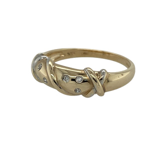 Add subtle sparkle and elegance to your collection with this pre-owned 9ct yellow gold diamond crossover band ring, a timeless style with graceful detail.

Design: The ring features a 5mm wide band with crossover detailing, accented with diamonds for a refined finish.
Material: Made in 9-carat yellow gold, the polished surface enhances the warm golden tone and the brilliance of the diamonds.
Ring Detail: The crossover style symbolises unity and flow, making this piece both meaningful and versatile.