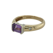Load image into Gallery viewer, Add rich colour and sparkle to your collection with this pre-owned 9ct yellow gold amethyst and diamond ring, a timeless piece with elegant detail.

Design: The ring features a 5mm by 7mm rectangular amethyst at the centre, accented with diamonds that enhance its deep purple hue.
Material: Made in 9-carat yellow gold, the polished finish provides a warm backdrop that complements the vibrancy of the gemstone and the brilliance of the diamonds.
