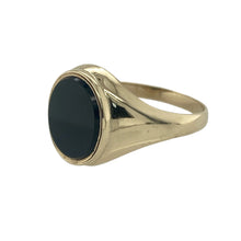 Load image into Gallery viewer, Bring bold sophistication and sleek contrast to your collection with this pre-owned 9ct yellow gold and onyx oval signet ring, offering a timeless design with a strong statement finish—perfect for both classic styling and everyday wear.

Design: The ring features an oval-cut black onyx measuring 11mm by 10mm, creating a smooth, polished centrepiece that delivers striking depth and elegance.
