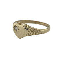 Load image into Gallery viewer, Bring charm and sparkle to your collection with this pre-owned 9ct yellow gold and cubic zirconia heart signet ring, blending playful design with elegant detail—perfect for everyday wear or as a thoughtful gift.

Design: The ring features a heart-shaped front measuring 7mm high, adorned with a sparkling cubic zirconia for a delicate and eye-catching finish.
Material: Made from 9-carat yellow gold, the polished band enhances the brilliance of the stone while giving the piece a warm and classic appearance.
