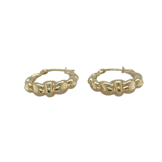 Bring elegant texture and classic style to your collection with these pre-owned 9ct yellow gold bubble twist oval creole earrings, a versatile pair perfect for both everyday wear and special occasions.

Design: The earrings feature an oval creole shape with a bubble twist pattern, creating a distinctive and eye-catching finish.
Material: Made from 9-carat yellow gold, the polished surface enhances the textured design while adding a warm, timeless glow.