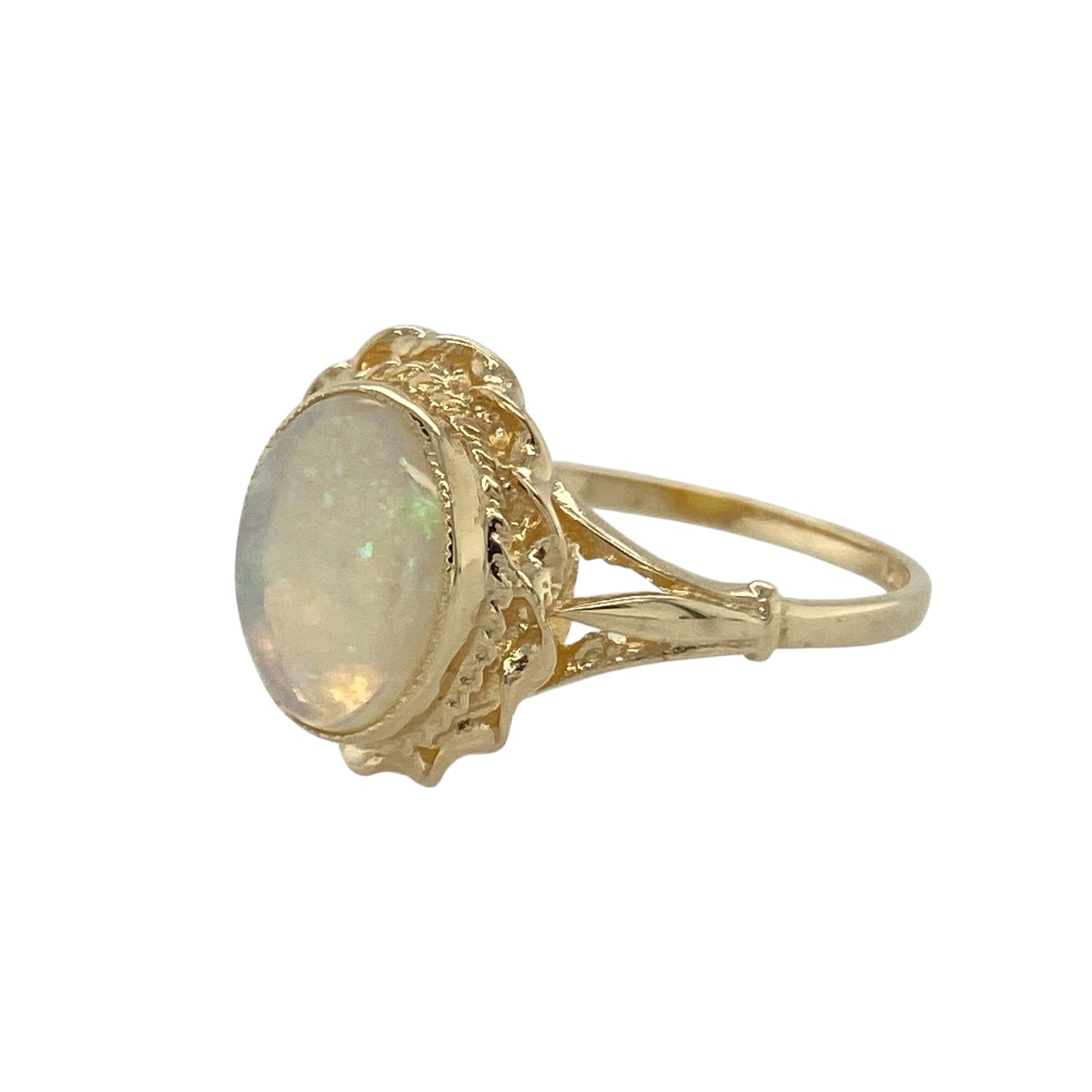 Bring soft colour and classic elegance to your collection with this pre-owned 9ct yellow gold opalique oval ring, a refined design enhanced by a traditional rope-style surround.

Design: The ring features an oval opalique stone measuring 10mm by 8mm, framed with a rope-style border that adds texture and timeless detail.
Material: Made from 9-carat yellow gold, the polished finish complements the iridescent tones of the opalique while providing a warm glow.