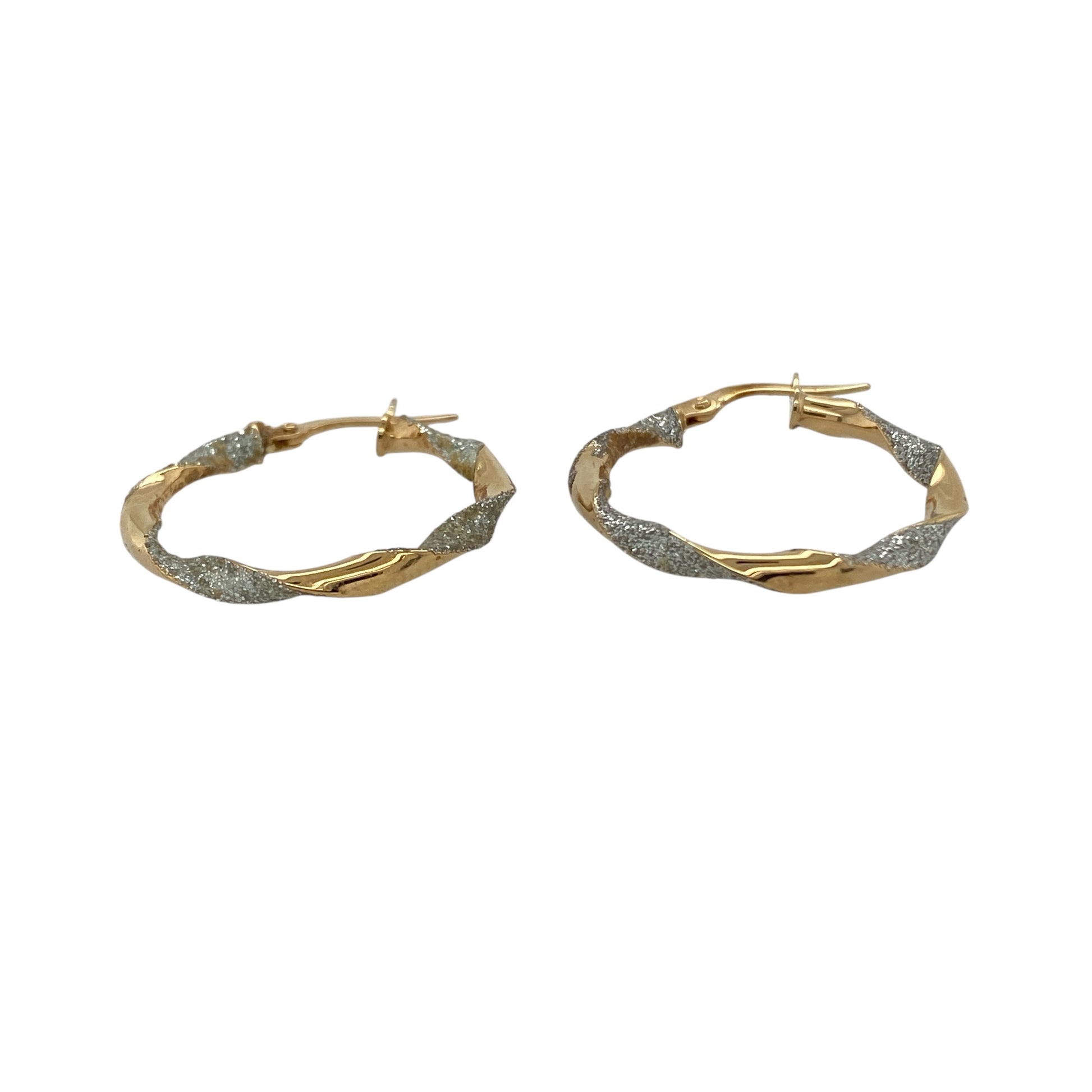 Bring elegant detail and timeless shine to your collection with these pre-owned 9ct yellow and white gold twisted sparkle hoop creole earrings, a versatile pair perfect for day-to-night wear.

Design: The earrings feature a hoop creole shape with a twisted two-tone design, combining yellow and white gold with a sparkling finish for added brilliance.
Material: Made from 9-carat yellow and white gold, the polished surfaces enhance the contrasting tones while giving the earrings a refined glow.