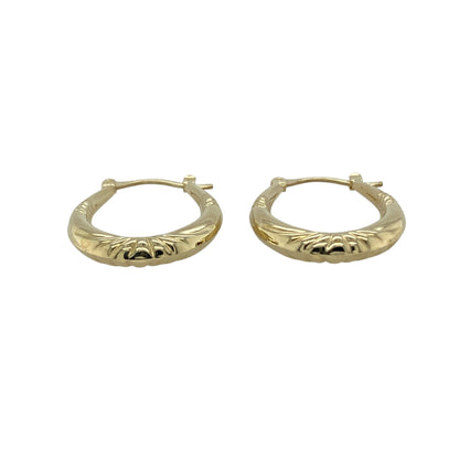 Bring elegant detail and timeless style to your collection with these pre-owned 9ct yellow gold patterned oval creole earrings, a versatile pair perfect for everyday wear or special occasions.

Design: The earrings feature a classic oval creole shape with a patterned surface, adding subtle texture and charm to a traditional style.
Material: Made from 9-carat yellow gold, the polished finish enhances the detailing while giving the earrings a warm glow.