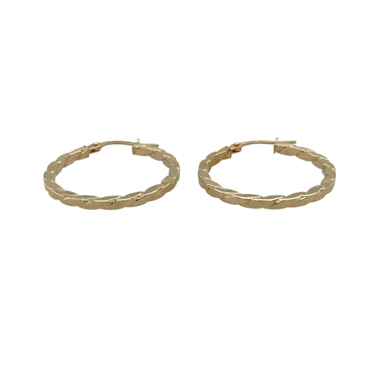 Bring texture and shine to your collection with these pre-owned 9ct yellow gold twisted flat hoop creole earrings, a stylish design perfect for both everyday wear and special occasions.

Design: The earrings feature a hoop creole shape with a flat twisted design, creating a reflective surface that catches the light beautifully.
Material: Made from 9-carat yellow gold, the polished finish enhances the twist pattern while adding a warm glow.
