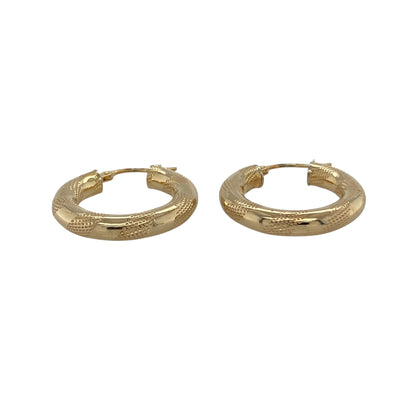 Bring stylish texture and timeless shine to your collection with these pre-owned 9ct yellow gold stripe patterned hoop creole earrings, a versatile pair perfect for both everyday wear and evening style.

Design: The earrings feature a classic hoop creole shape with a striped textured pattern, adding depth and character to a traditional design.
Material: Made from 9-carat yellow gold, the polished finish enhances the textured surface while giving the earrings a warm glow.