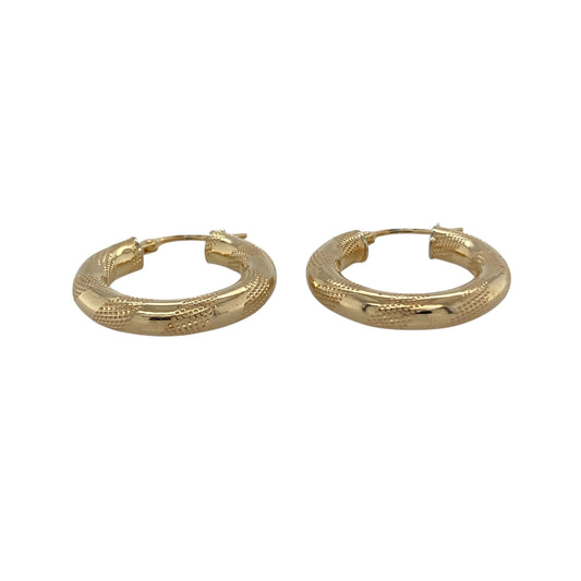 Bring stylish texture and timeless shine to your collection with these pre-owned 9ct yellow gold stripe patterned hoop creole earrings, a versatile pair perfect for both everyday wear and evening style.

Design: The earrings feature a classic hoop creole shape with a striped textured pattern, adding depth and character to a traditional design.
Material: Made from 9-carat yellow gold, the polished finish enhances the textured surface while giving the earrings a warm glow.