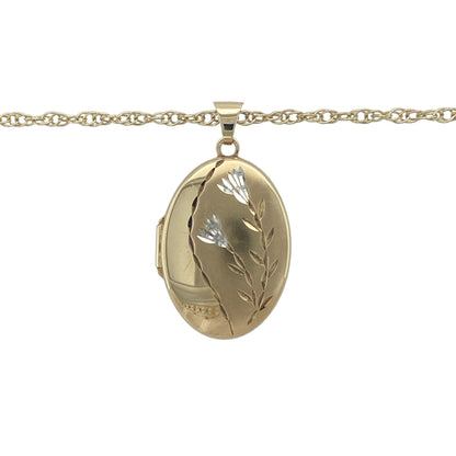 Bring sentimental elegance and timeless detail to your collection with this pre-owned 9ct yellow gold oval locket necklace, engraved with a floral design and suspended from a classic chain.

Design: The pendant measures 3.3cm long including the bail and features a traditional oval shape engraved with a delicate flower motif, adding charm and character.
Material: Made from 9-carat yellow gold, the polished finish enhances the engraved detailing while giving the piece a warm and refined glow.