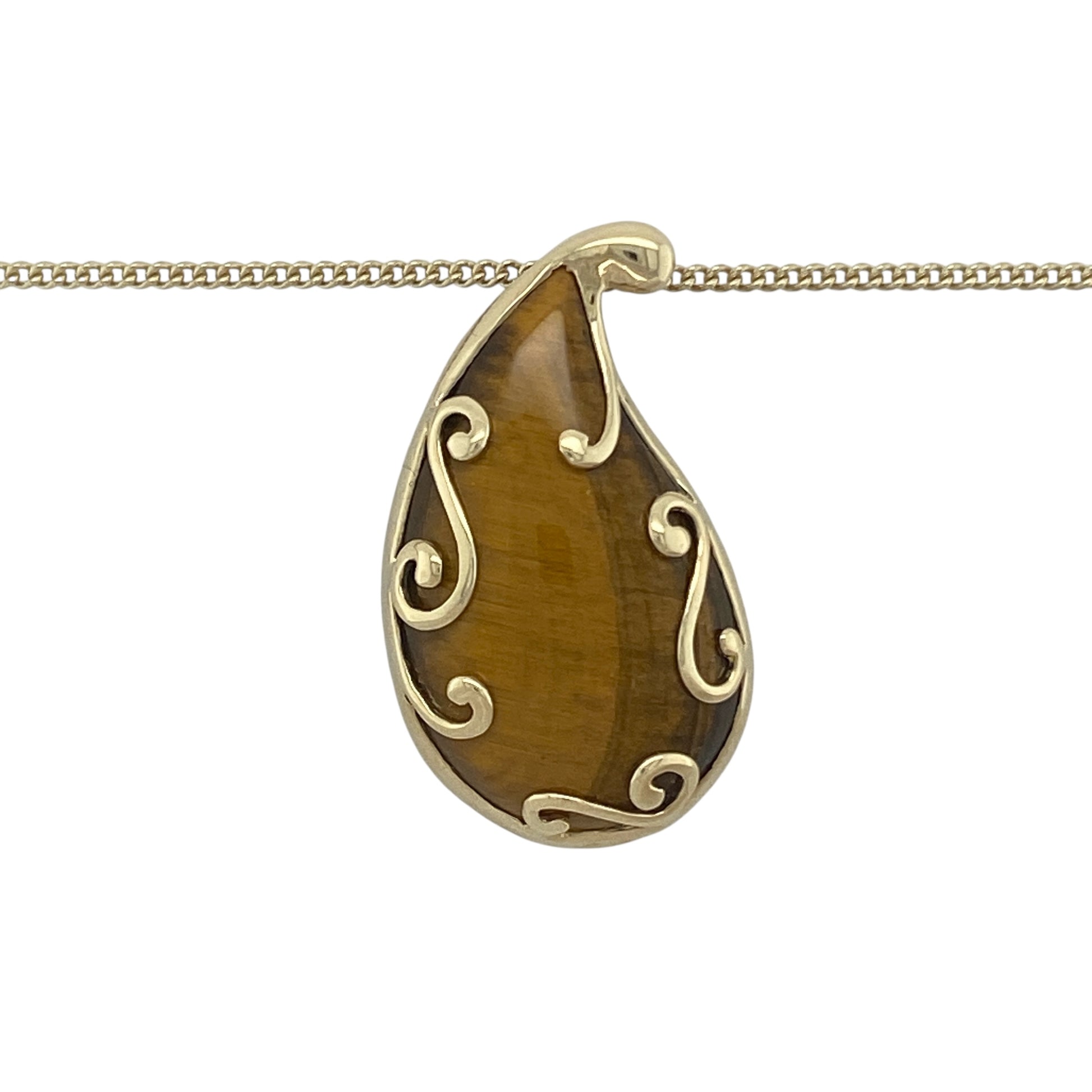 Bring natural beauty and bold elegance to your collection with this pre-owned 9ct yellow gold tiger’s eye teardrop pendant necklace, a striking piece perfect for adding colour and character.

Design: The necklace features a large 3cm long teardrop-shaped tiger’s eye pendant, showcasing the stone’s rich golden-brown tones and natural chatoyancy.
Material: Made from 9-carat yellow gold, the polished finish frames the gemstone beautifully while adding warmth and refinement.
