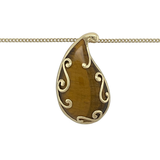 Bring natural beauty and bold elegance to your collection with this pre-owned 9ct yellow gold tiger’s eye teardrop pendant necklace, a striking piece perfect for adding colour and character.

Design: The necklace features a large 3cm long teardrop-shaped tiger’s eye pendant, showcasing the stone’s rich golden-brown tones and natural chatoyancy.
Material: Made from 9-carat yellow gold, the polished finish frames the gemstone beautifully while adding warmth and refinement.