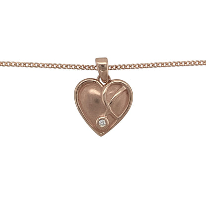 Bring romantic elegance and symbolic meaning to your collection with this pre-owned 9ct rose gold and diamond Clogau Vine of Life heart pendant necklace, a refined design celebrating love and harmony.

Design: The pendant measures 2.2cm long including the bail and features an open heart motif adorned with the delicate Vine of Life design, accented with sparkling diamonds for added brilliance.