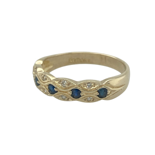 Bring refined sparkle and timeless colour to your collection with this pre-owned 9ct yellow gold diamond and sapphire patterned band ring, a versatile design perfect for both everyday wear and special occasions.

Design: The ring features a 5mm wide band detailed with a patterned finish, accented by alternating sapphires and diamonds for an elegant touch of colour and brilliance.