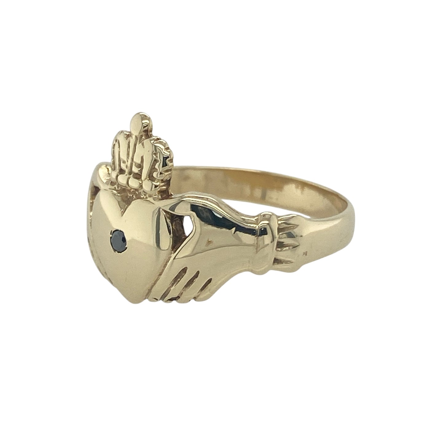 Bring symbolic meaning and striking detail to your collection with this pre-owned 9ct yellow gold black diamond Claddagh ring, a traditional design with a bold modern twist.

Design: The ring features the classic Claddagh motif—two hands holding a heart topped with a crown—measuring 15mm high, with a black diamond set at the centre for a distinctive finish.
Material: Made from 9-carat yellow gold, the polished band enhances the unique contrast of the dark gemstone against the warm gold.