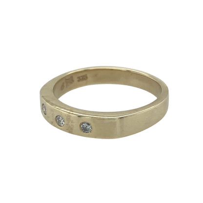 Bring classic sparkle and timeless elegance to your collection with this pre-owned 9ct yellow gold diamond trilogy band ring, a refined design perfect for both everyday wear and meaningful occasions.

Design: The ring features a 4mm wide band set with three sparkling diamonds, symbolising the past, present, and future in a balanced trilogy style.
Material: Made from 9-carat yellow gold, the polished finish enhances the brilliance of the diamonds while adding a warm and refined glow.