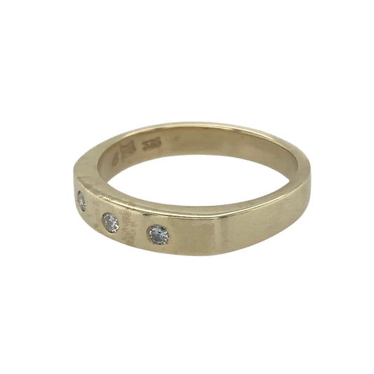 Bring classic sparkle and timeless elegance to your collection with this pre-owned 9ct yellow gold diamond trilogy band ring, a refined design perfect for both everyday wear and meaningful occasions.

Design: The ring features a 4mm wide band set with three sparkling diamonds, symbolising the past, present, and future in a balanced trilogy style.
Material: Made from 9-carat yellow gold, the polished finish enhances the brilliance of the diamonds while adding a warm and refined glow.