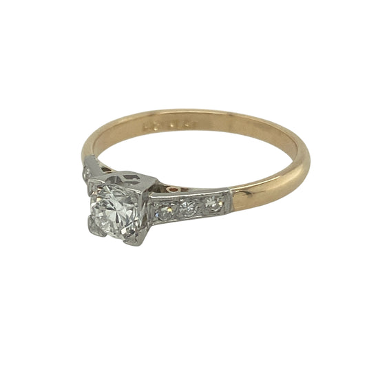 Bring timeless elegance and refined sparkle to your collection with this pre-owned 9ct yellow gold and platinum diamond solitaire ring, a classic design perfect for special occasions or lasting everyday luxury.

Design: The ring features a central brilliant-cut diamond of approximately 0.28ct, complemented by smaller diamonds set into the shoulders for added brilliance. The diamond is approximately SI2 clarity, offering lively sparkle.