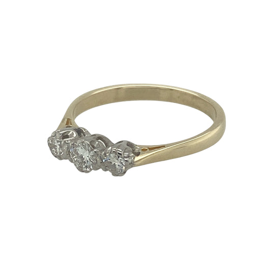 Bring refined sparkle and timeless meaning to your collection with this pre-owned 9ct yellow gold diamond trilogy ring, a classic design symbolising the past, present, and future.

Design: The ring is set with approximately 0.22ct of diamonds in a balanced trilogy arrangement, creating an elegant and symbolic look.
Material: Made from 9-carat yellow gold, the polished finish enhances the brilliance of the diamonds with a warm and classic glow.
