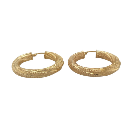Bring timeless sophistication and golden warmth to your collection with these pre-owned 9ct yellow gold patterned twist hoop creole earrings, offering classic style with a touch of detail—ideal for elevating both everyday looks and special occasions.

Design: The earrings feature a twisted creole design with subtle patterning, creating an elegant play of texture and shine that enhances their versatile appeal.