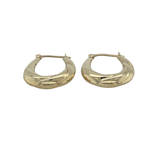 Bring subtle elegance and golden detail to your collection with these pre-owned 9ct yellow gold twist patterned oval creole earrings, offering timeless style with a touch of texture.

Design: The earrings feature an oval creole shape with a refined twist pattern, creating gentle movement and light-catching appeal.
Material: Made from 9-carat yellow gold, the polished finish enhances the warm tone and highlights the textured design.