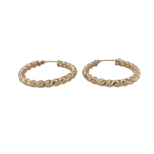 Bring timeless elegance and golden radiance to your collection with these pre-owned 9ct yellow gold twisted hoop creole earrings, a classic design with subtle texture and shine.

Design: The earrings feature a traditional hoop creole style with a gentle twisted detail, adding depth and light-catching appeal.
Material: Made from 9-carat yellow gold, the polished finish enhances the warm tone and highlights the twist pattern.