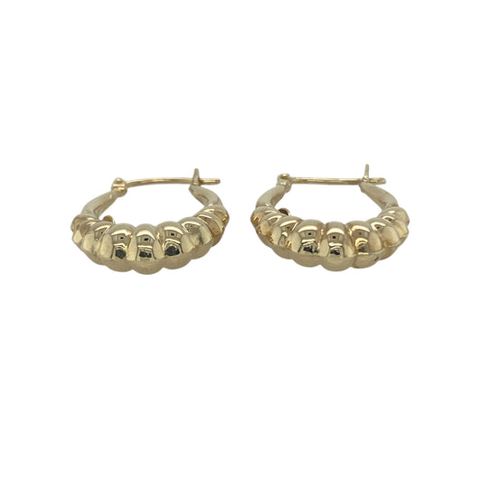 Bring playful texture and golden shine to your collection with these pre-owned 9ct yellow gold bubble style oval creole earrings, a unique design with timeless appeal.

Design: The earrings feature an oval creole shape with a bubble-style pattern, creating a distinctive look with added depth and character.
Material: Made from 9-carat yellow gold, the polished finish enhances the warm tone and highlights the raised detailing.