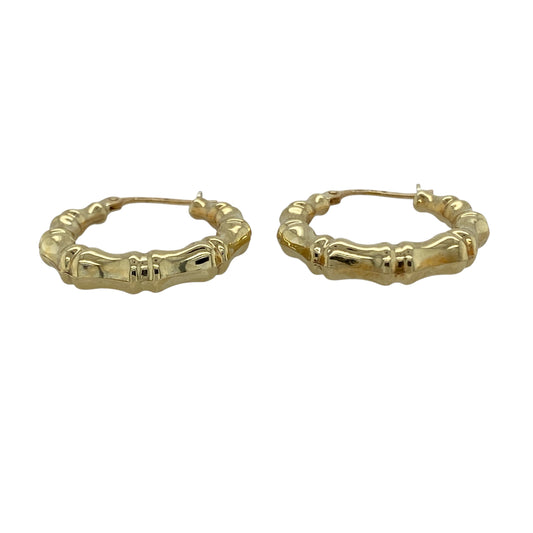 Bring unique texture and golden character to your collection with these pre-owned 9ct yellow gold bamboo hoop creole earrings, a stylish twist on a classic design.

Design: The earrings feature a traditional hoop creole shape with a bamboo-inspired pattern, adding distinctive detail and depth.
Material: Made from 9-carat yellow gold, the polished finish enhances the warm tone and highlights the textured design.