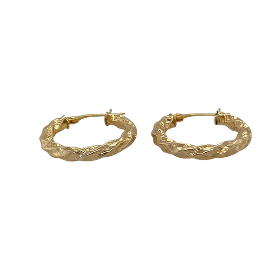 Bring classic elegance and golden shine to your collection with these pre-owned 9ct yellow gold twisted hoop creole earrings, a timeless design with subtle detail.

Design: The earrings feature a traditional hoop creole shape with a gentle twisted pattern, adding texture and light-catching appeal.
Material: Made from 9-carat yellow gold, the polished finish enhances the warm tone and highlights the twist design.
