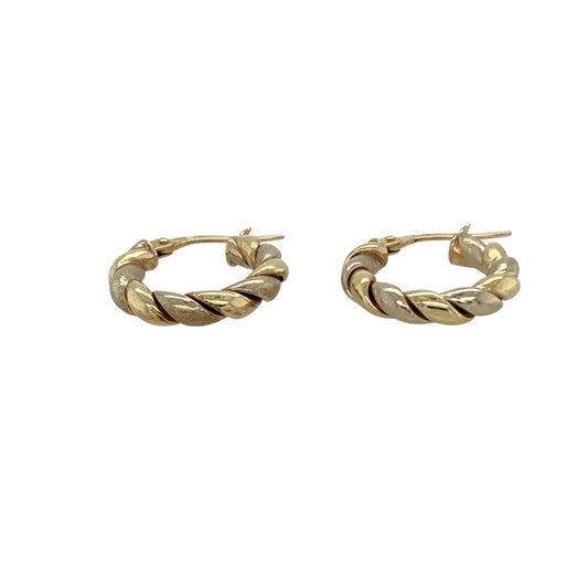 Bring subtle elegance and golden detail to your collection with these pre-owned 9ct yellow gold small twisted hoop creole earrings, a delicate design with timeless appeal.

Design: The earrings feature a small hoop creole shape with a gentle twisted pattern, adding refined texture and light-catching charm.
Material: Made from 9-carat yellow gold, the polished finish enhances the warm tone and highlights the twist detail.