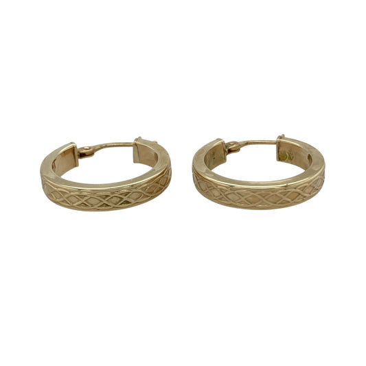 Bring timeless character and golden detail to your collection with these pre-owned 9ct yellow gold Celtic style hoop creole earrings, a distinctive design with refined charm.

Design: The earrings feature a classic hoop creole shape with intricate Celtic-inspired detailing, adding depth and individuality.
Material: Made from 9-carat yellow gold, the polished finish enhances the warm tone and highlights the detailed design. 
