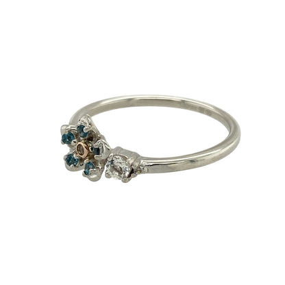 Bring floral elegance and meaningful charm to your collection with this pre-owned Clogau Forget Me Not flower ring in silver, 9ct rose gold, and topaz—a delicate design symbolising remembrance and enduring love.

Design: The ring features an 8mm flower motif adorned with blue and white topaz stones, highlighted with 9ct rose gold accents for a soft and romantic finish.