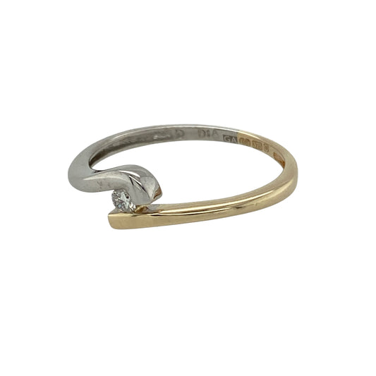 Bring subtle sparkle and elegant design to your collection with this pre-owned 9ct yellow and white gold diamond solitaire twist ring—a timeless piece with a modern touch.

Design: The ring features a single diamond of approximately 0.05ct, held in a graceful twist setting that blends yellow and white gold for a refined two-tone finish.
Material: Made from 9-carat yellow and white gold, the polished surface enhances the brilliance of the diamond and the sophistication of the setting.
