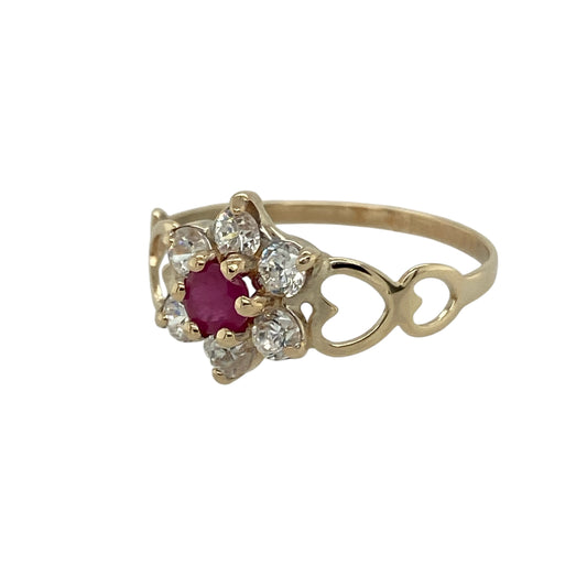 Bring vibrant colour and delicate sparkle to your collection with this pre-owned 9ct yellow gold ruby and cubic zirconia flower cluster ring—a graceful design full of charm and elegance.

Design: The ring features a central ruby of approximately 4mm in diameter, surrounded by sparkling cubic zirconia stones arranged in a classic flower cluster style.
Material: Made from 9-carat yellow gold with ruby and cubic zirconia, the polished finish enhances the warmth of the gold and the brilliance of the stones.
