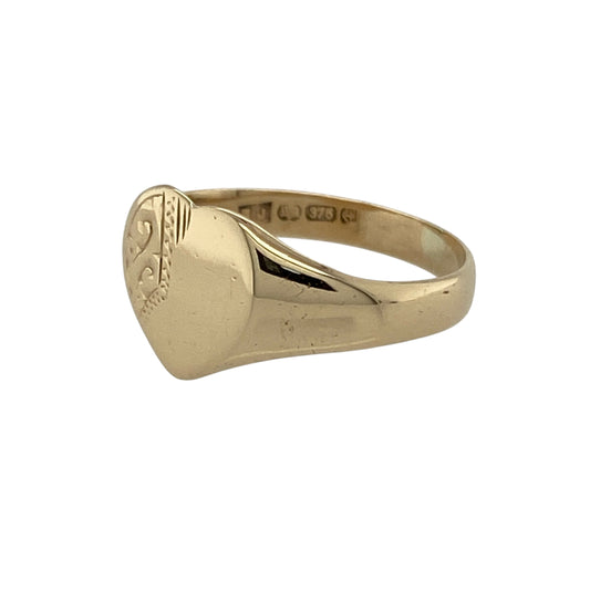 Bring romantic charm and classic style to your collection with this pre-owned 9ct yellow gold patterned heart signet ring—a timeless piece with delicate detail.

Design: The ring features a 9mm high heart-shaped front with an engraved patterned finish, adding subtle texture and character.
Material: Made from 9-carat yellow gold, the polished surface highlights both the engraved detail and the warm golden tones.