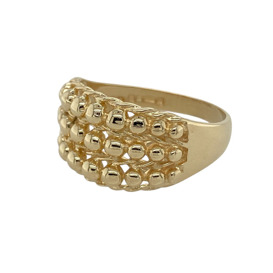 Bring bold texture and traditional style to your collection with this pre-owned 9ct gold three-row keeper ring—a classic design with strong character and presence.

Design: The ring features an 11mm high front with three raised rows in the iconic keeper style, creating depth and distinctive detail.
Material: Made from 9-carat gold, the polished finish enhances the bold design and warm golden tones.