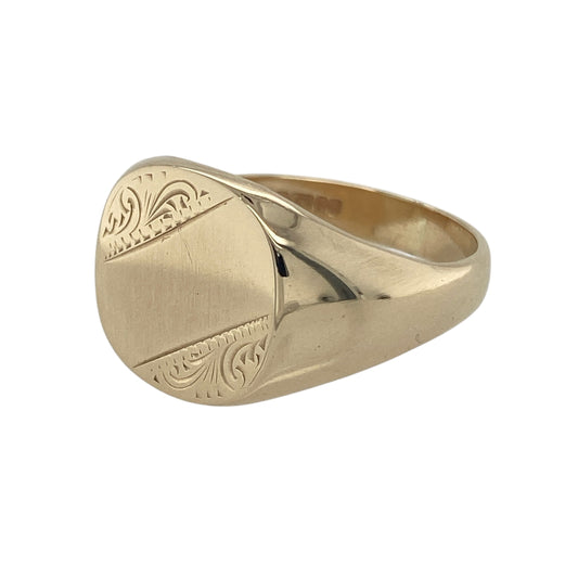 Bring bold style and traditional character to your collection with this pre-owned 9ct yellow gold patterned signet ring—a substantial piece with a classic presence.

Design: The ring features a 14mm high front with an engraved patterned finish, adding depth and detail to the traditional signet style.
Material: Made from 9-carat yellow gold, the polished surface enhances the engraved texture and warm golden tones.